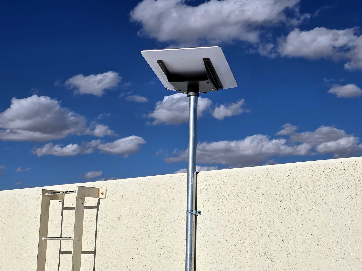Real Miclyn commercial Enterprise Starlink installation — pole-mounted Starlink Enterprise antenna on a rooftop
