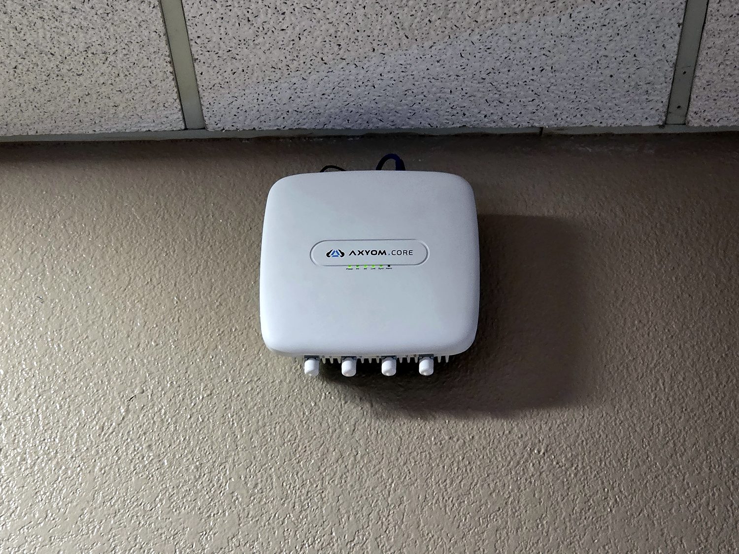 Miclyn in-building 4G/5G cellular coverage equipment mounted on an interior wall in a challenging concrete-and-metal environment