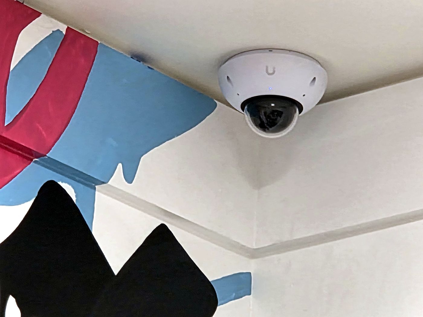UniFi commercial security camera installed on a ceiling by Miclyn