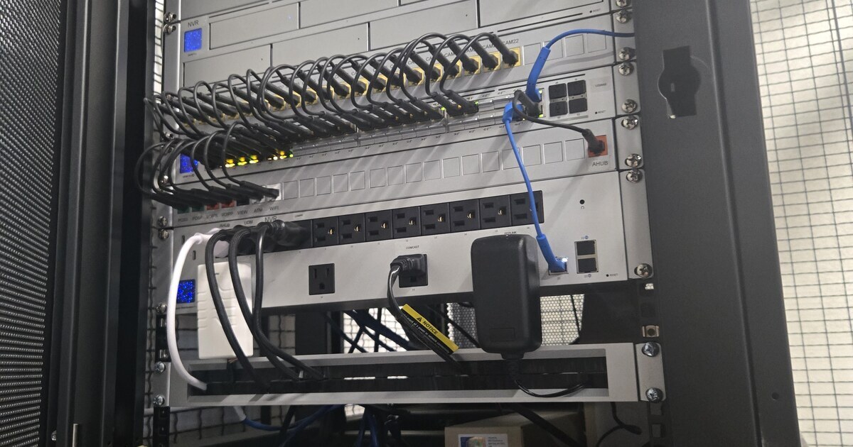 A clean, professionally managed network rack running quietly in the background.